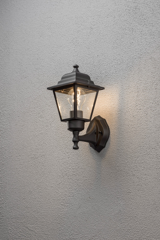 Konstsmide Wandleuchte, schwarz matt, klares Glas, aufwärts